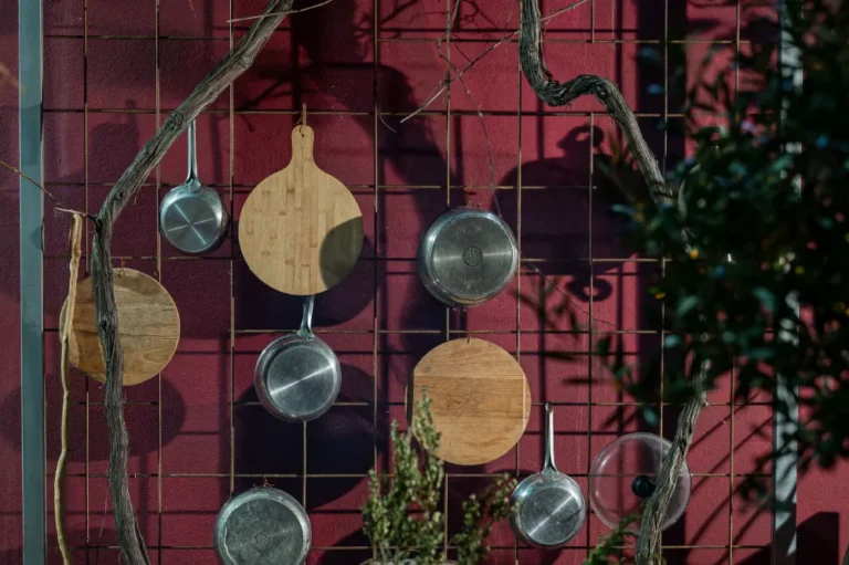 Cooking skillets and cutting boards hanged.