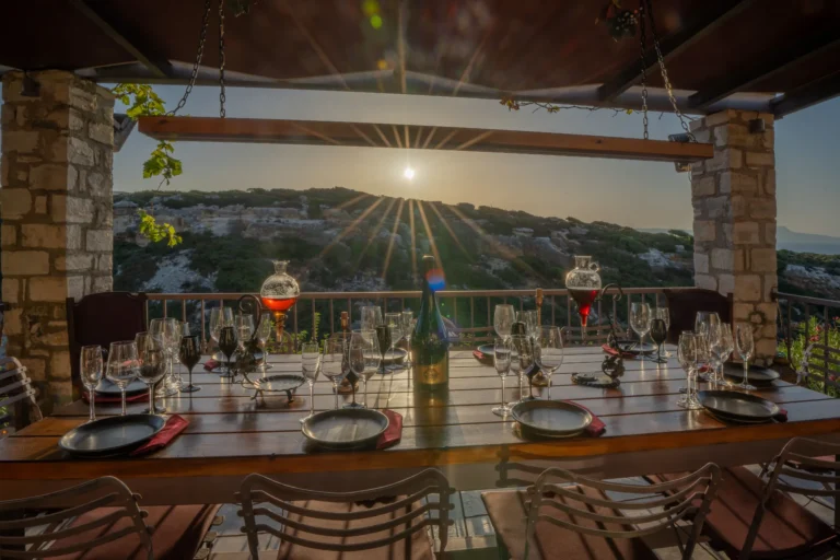 Wine tasting and traditional Cretan food table, with sunshine background.