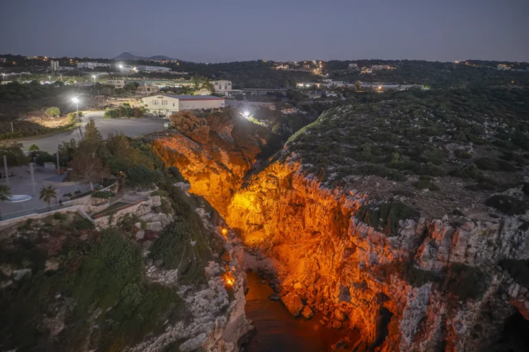 Aerial view of Zourida Gorge in Rethymno illuminated at night.